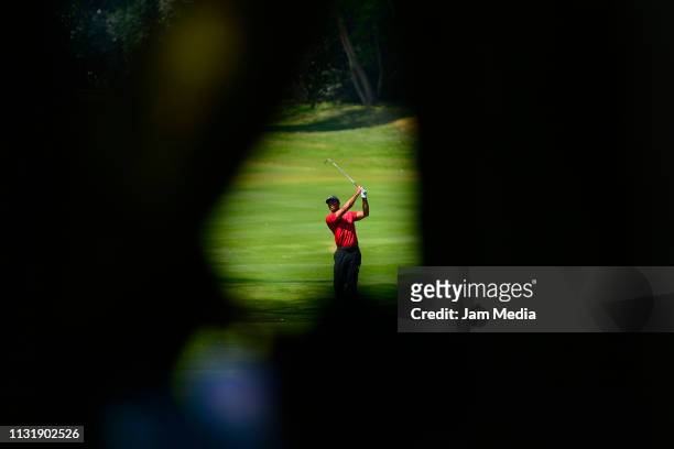 Tiger Woods of the United States plays a shot during the final round of World Golf Championships-Mexico Championship at Club de Golf Chapultepec on...