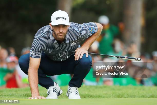 Dustin Johnson of the United States lines up a putt on the 18th green during the final round of World Golf Championships-Mexico Championship at Club...