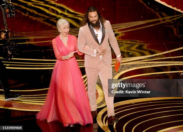 Helen Mirren and Jason Momoa speak onstage during the 91st Annual Academy Awards at Dolby Theatre on February 24, 2019 in Hollywood, California.