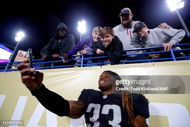 Trent Richardson of Birmingham Iron takes a selfie with fans after the Alliance of American Football game against the Atlanta Legends at Georgia...