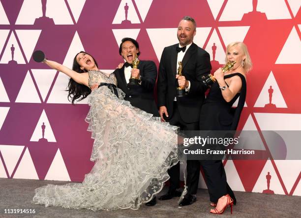 Elizabeth Chai Vasarhelyi, Jimmy Chin, Evan Hayes, and Shannon Dill, winners of Best Documentary Feature for "Free Solo," pose in the press room...