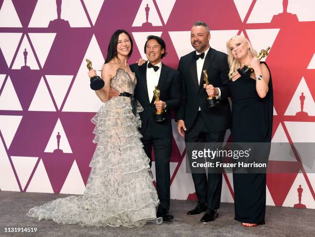 Elizabeth Chai Vasarhelyi, Jimmy Chin, Evan Hayes, and Shannon Dill, winners of Best Documentary Feature for "Free Solo," pose in the press room...