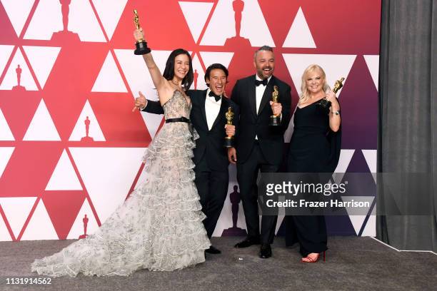 Elizabeth Chai Vasarhelyi, Jimmy Chin, Evan Hayes, and Shannon Dill, winners of Best Documentary Feature for "Free Solo," pose in the press room...