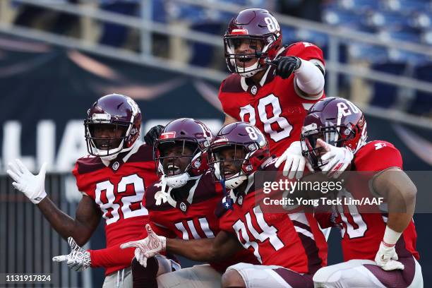 Mekale McKay of the San Antonio Commanders celebrates with his teammates after scoring a touchdown against the San Diego Fleet during the first half...