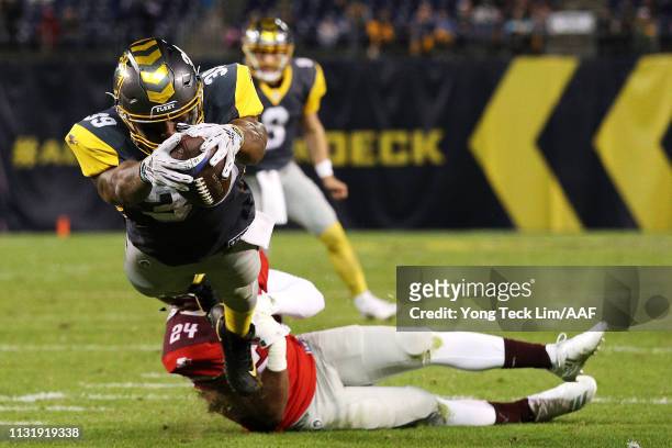 Terrell Watson of the San Diego Fleet scores a conversion past Nick Orr of the San Antonio Commanders during the first half of an Alliance of...