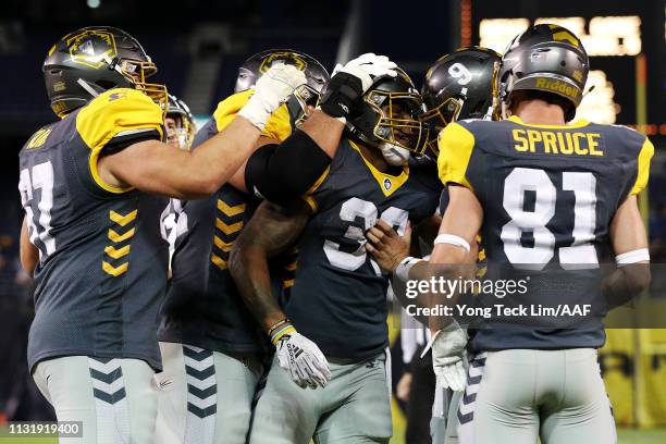 Terrell Watson of the San Diego Fleet celebrates with his teammates after scoring a conversion against the San Antonio Commanders during the first...