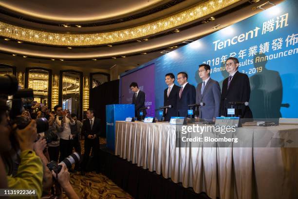 John Lo, chief financial officer of Tencent Holdings Ltd., from right, Ma Huateng, chairman and chief executive officer, Martin Lau, president, and...