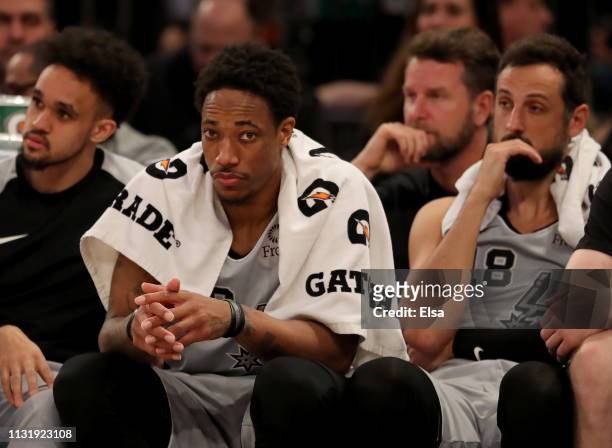 DeMar DeRozan and Marco Belinelli of the San Antonio Spurs react on the bench as the New York Knicks win the game at Madison Square Garden on...