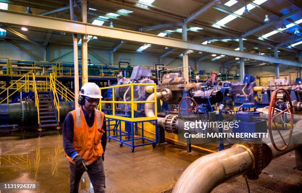 Worker walks at a desalination plant in Antofagasta, Chile on February 25, 2019. - In the north of Chile, covered by the most arid desert in the...