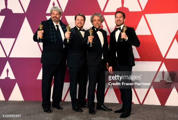 Ian Hunter, J.D. Schwalm, Paul Lambert, and Tristan Myles, winners of Best Visual Effects for "First Man," pose in the press room during the 91st...