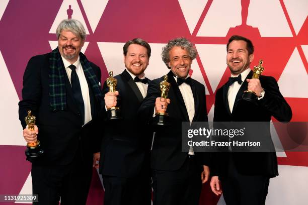 Ian Hunter, J.D. Schwalm, Paul Lambert, and Tristan Myles, winners of Best Visual Effects for "First Man," pose in the press room during the 91st...