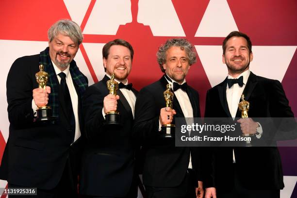 Ian Hunter, J.D. Schwalm, Paul Lambert, and Tristan Myles, winners of Best Visual Effects for "First Man," pose in the press room during the 91st...