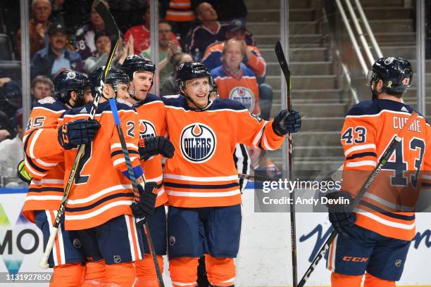 Kyle Brodziak, Matthew Benning, Josh Currie, Andrej Sekera and Joseph Gambardella of the Edmonton Oilers celebrate after a goal during the game...