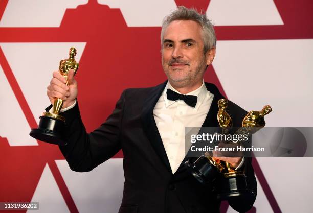 Alfonso Cuaron, winner of Best Foreign Language Film, Best Director and Best Cinematography for "Roma," poses in the press room during the 91st...