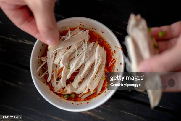 spicy shredded chicken meat - hand chicken wing stock pictures, royalty-free photos & images