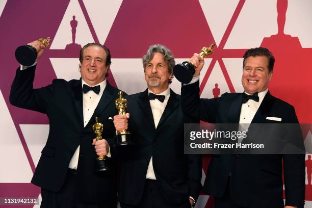 Nick Vallelonga, Peter Farrelly and Brian Currie, winners of Best Picture and Best Original Screenplay for "Green Book," pose in the press room...
