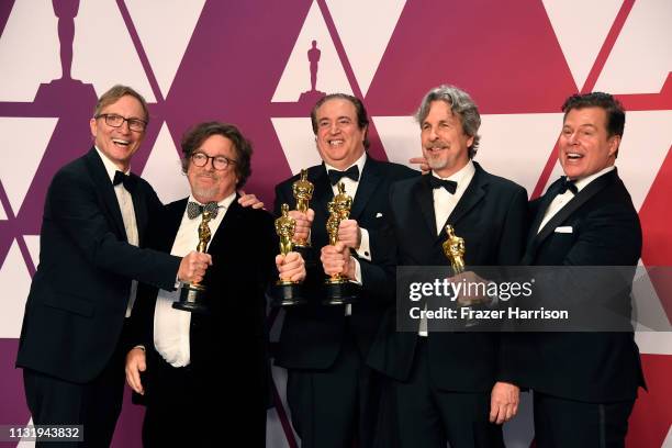 Jim Burke, Charles B. Wessler, Nick Vallelonga, Peter Farrelly, and Brian Currie, winners of Best Picture for "Green Book," pose in the press room...