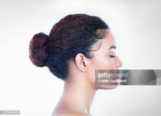 keeping her makeup simple but effective - hair back stock pictures, royalty-free photos & images