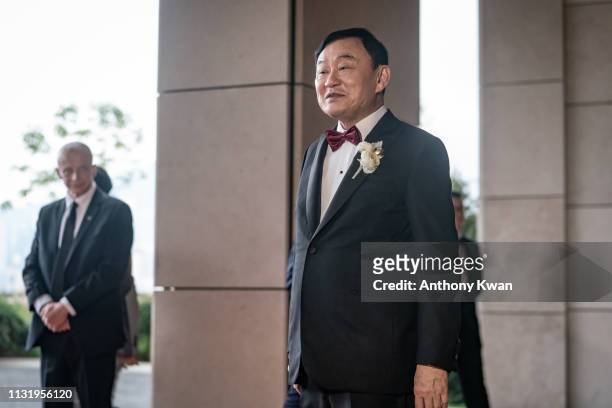 Former Thai prime minister Thaksin Shinawatra waits for guests at the wedding of his youngest daughter, Paetongtarn Shinawatra, at Rosewood Hotel on...