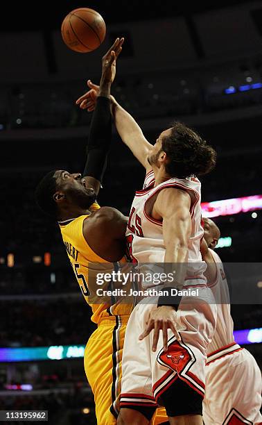 Joakim Noah of the Chicago Bulls blocks a shot by Roy Hibbert of the Indiana Pacers in Game Five of the Eastern Conference Quarterfinals in the 2011...