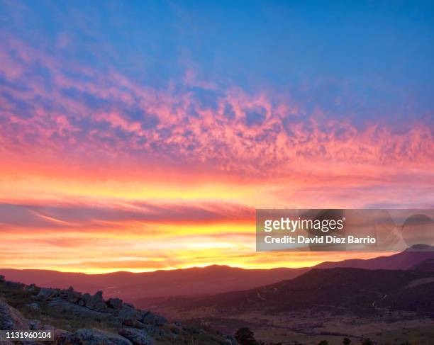 fire in the sky. sunset in the 'sierra de guadarrama' - paisaje escénico stock pictures, royalty-free photos & images