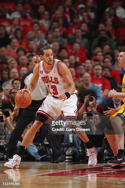 Joakim Noah of the Chicago Bulls drives to the basket against Tyler Hansbrough of the Indiana Pacers in Game Five of the Eastern Conference...