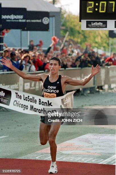 Chicago Marathon defending champion Khalid Khannouchi is the first runner to cross the finish line 22 October 2000 in Chicago, Illinois, making him...
