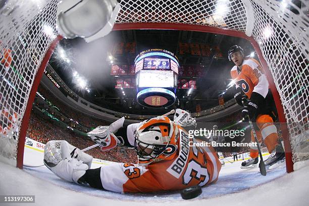 Brian Boucher of the Philadelphia Flyers fails to block a third period goal by Tyler Myers of the Buffalo Sabres in Game Seven of the Eastern...