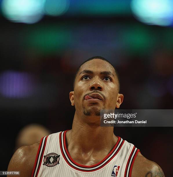 Derrick Rose of the Chicago Bulls heads back down the court after hitting a three-point shot against the Indiana Pacers in Game Five of the Eastern...