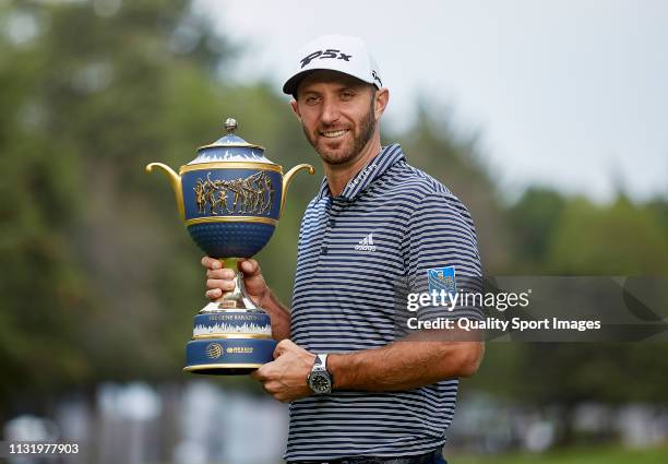 Dustin Johnson of the United States poses with the Gene Sarazen Cup after winning during the final round of World Golf Championships-Mexico...