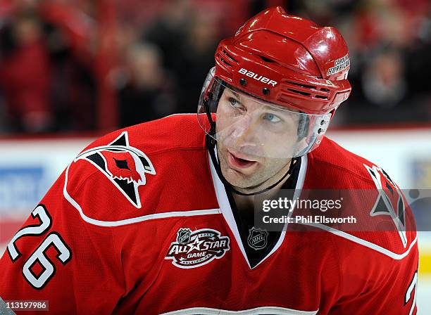 Erik Cole of the Carolina Hurricanes lines up for a faceoff during an NHL game on March 22, 2011 at RBC Center in Raleigh, North Carolina.
