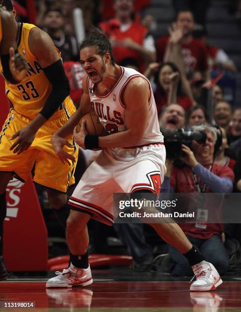 Joakim Noah of the Chicago Bulls yells as he grabs a rebound against the Indiana Pacers in Game Five of the Eastern Conference Quarterfinals in the...