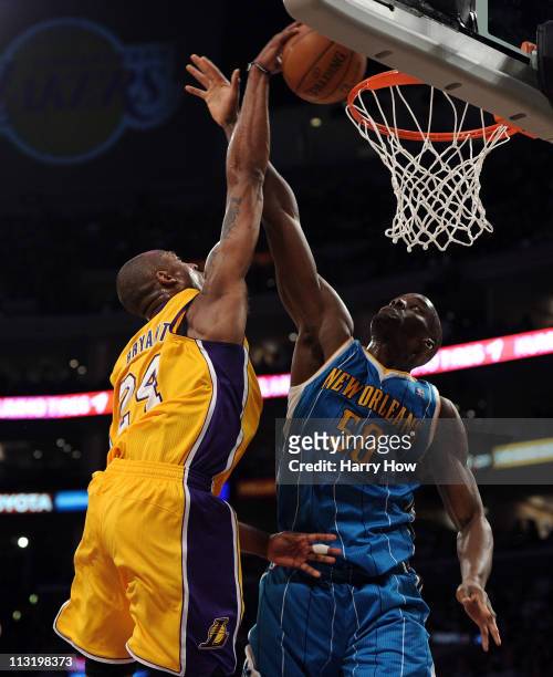 Kobe Bryant of the Los Angeles Lakers dunks the ball over Emeka Okafor of the New Orleans Hornets in the second quarter in Game Five of the Western...