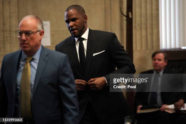 Singer R. Kelly appears in court with his attorney Steve Greenberg for a hearing to request that he be allowed to travel to Dubai at the Leighton...