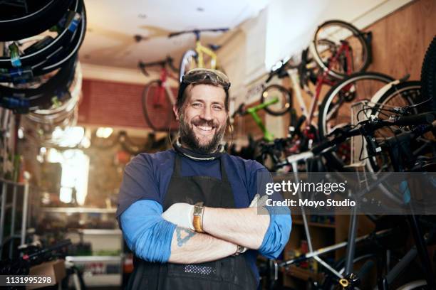 bring all your bike repairs and maintenance jobs to me - smiling professional at work tools imagens e fotografias de stock