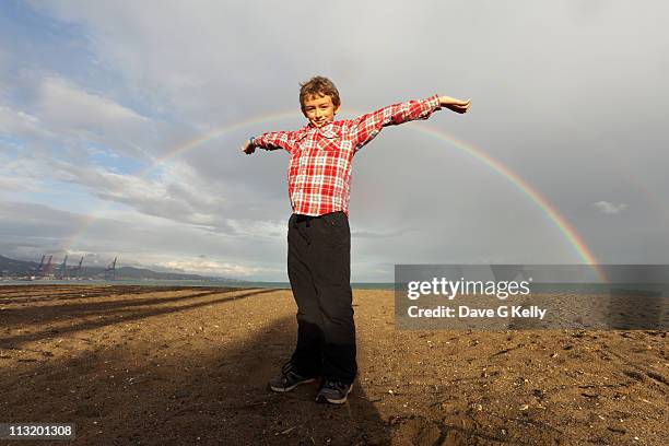 rainbows with boy - child boy arms out stock pictures, royalty-free photos & images