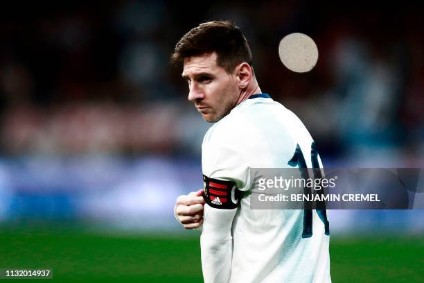 Argentina's forward Lionel Messi adjusts his captain's armband ahead an international friendly football match between Argentina and Venezuela at the...