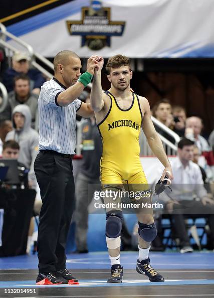 Steven Rudnik Michigan Steven Micic of the Michigan Wolverines gets his hand raised after ...