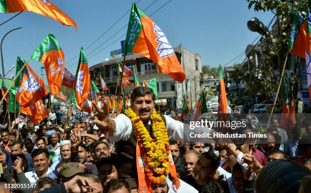 Union Minister and BJP Candidate Jugal Kishore Sharma shows victory sign as he arrives to file his nomination for Jammu-Poonch constituency ahead of...