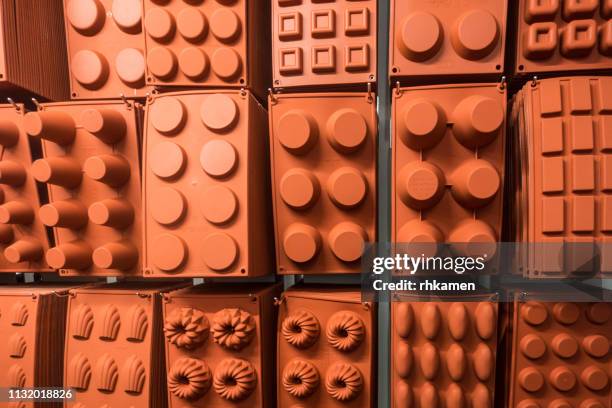 orange silicone baking moulds, amsterdam, netherlands. - moulds stock pictures, royalty-free photos & images