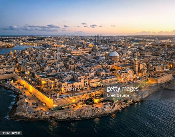 aerial panorama of valletta old town at sunset, malta - malta aerial stock pictures, royalty-free photos & images