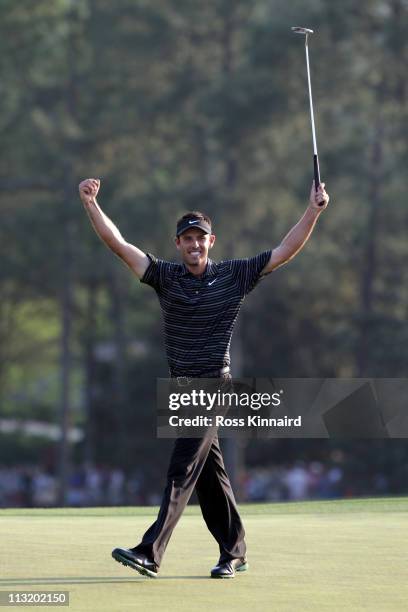 Charl Schwartzel of South Africa celebrates his birdie on the 18th green and winning the Masters during the final round of the 2011 Masters...