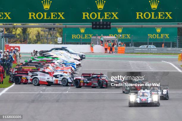 Porsche 919 Hybrid on pole position at the start grid with the rest of the field, including the Toyota TS050 Hybrid and Audi R18, following from the...