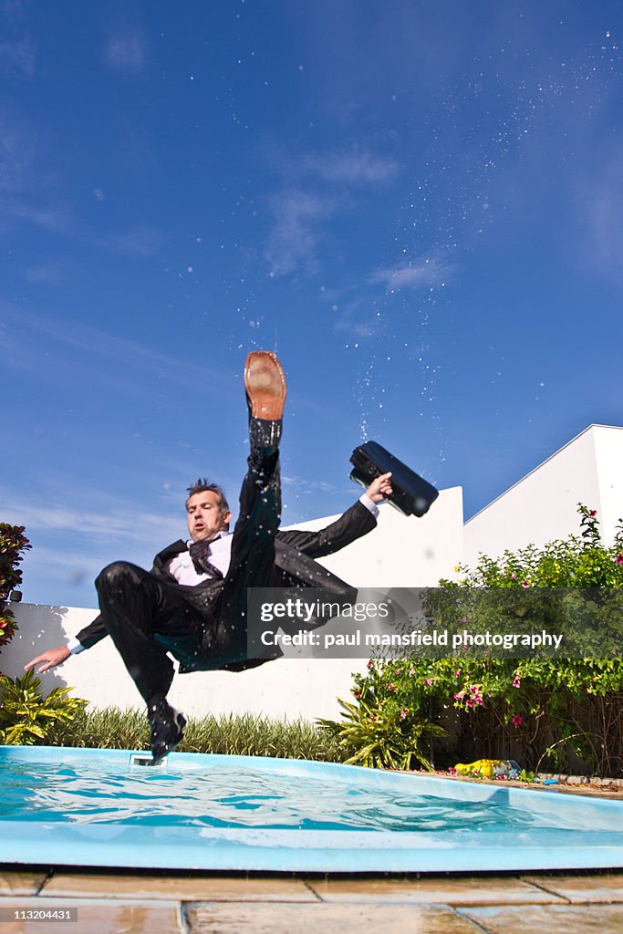 Falling Pool Businessman Falling Into Swimming Pool High-Res Stock Photo - Getty Images