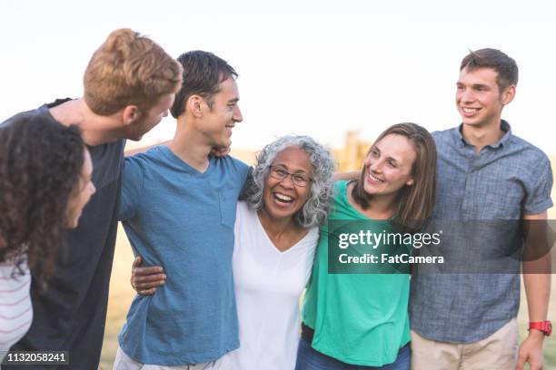 portrait of a multigenerational family outdoors - idade humana imagens e fotografias de stock
