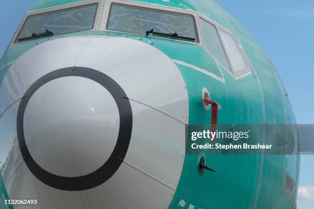 One of two sensors that measures the angle of attack is pictured at bottom on a Boeing 737 MAX 8 airplane outside the company's factory on March 22,...