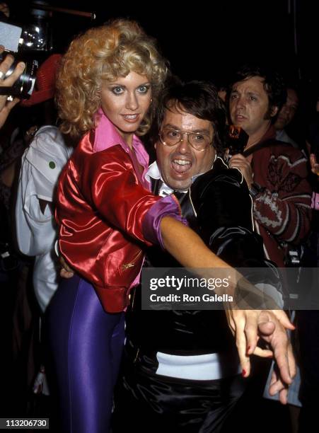 Singer Olivia Newton-John and producer Allan Carr attend the "Grease" Premiere Party on June 13, 1978 at Studio 54 in New York City.