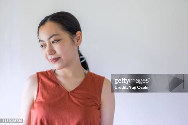 portrait of asian young woman with ponytail - sleeveless ストックフォトと画像