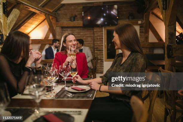 best female friends in a restaurant - ladies night wine stock pictures, royalty-free photos & images