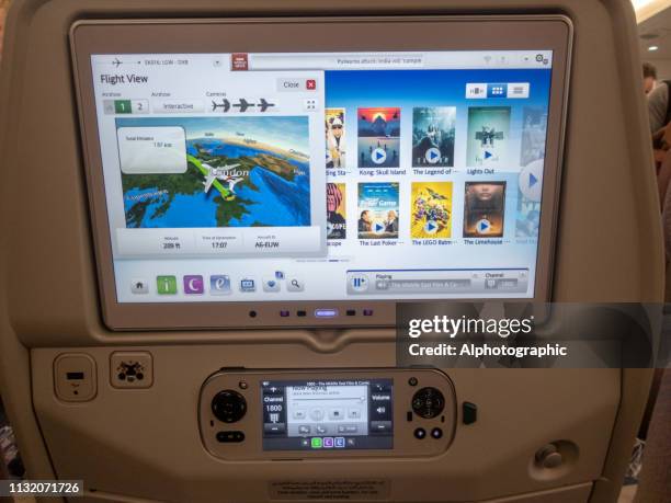 entertainment system in the back of the seat on a commercial long haul flight - airbus concept cabin stock pictures, royalty-free photos & images